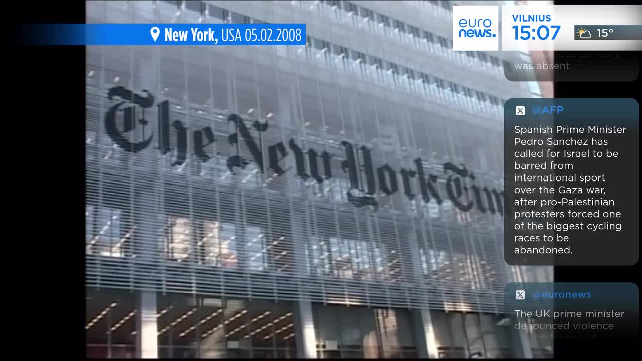 The facade of The New York Times building fills the frame, its large, gothic lettering prominent. News headlines from Euronews English and other sources are displayed over the image, providing context.
