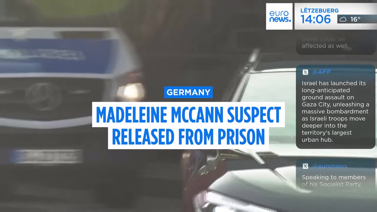 A pair of dark-colored cars are moving, their details obscured by the camera's focus. The Euronews English graphic displays text about the Madeleine McCann suspect's release in Germany.
