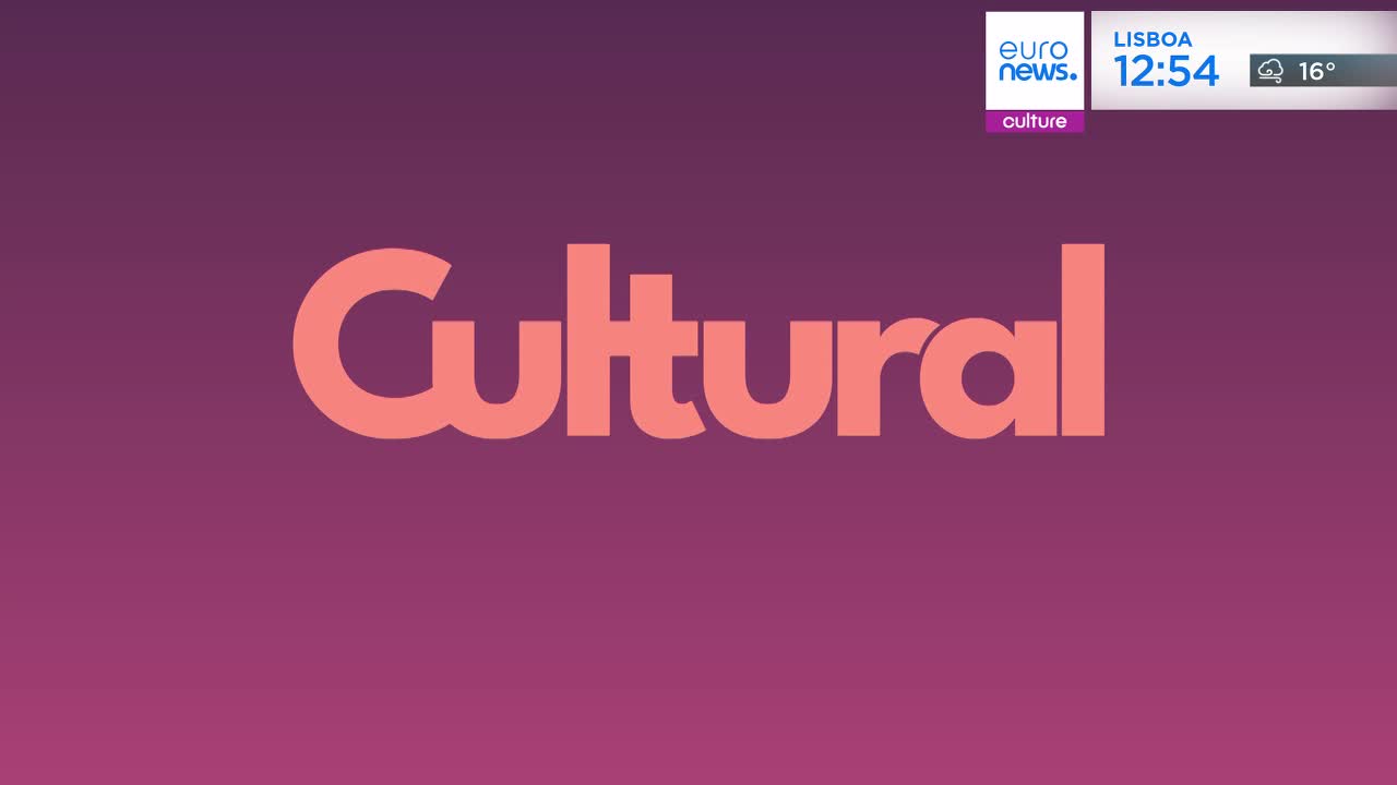The word "Cultural" appears in large, coral-colored letters against a deep purple background. A small Euronews graphic in the upper right corner shows the time in Lisbon as 12:54 with a temperature of 16 degrees. The word "Cultural" appears in large, coral-colored letters against a deep purple background. A small Euronews graphic in the upper right corner shows the time in Lisbon as 12:54 with a temperature of 16 degrees.