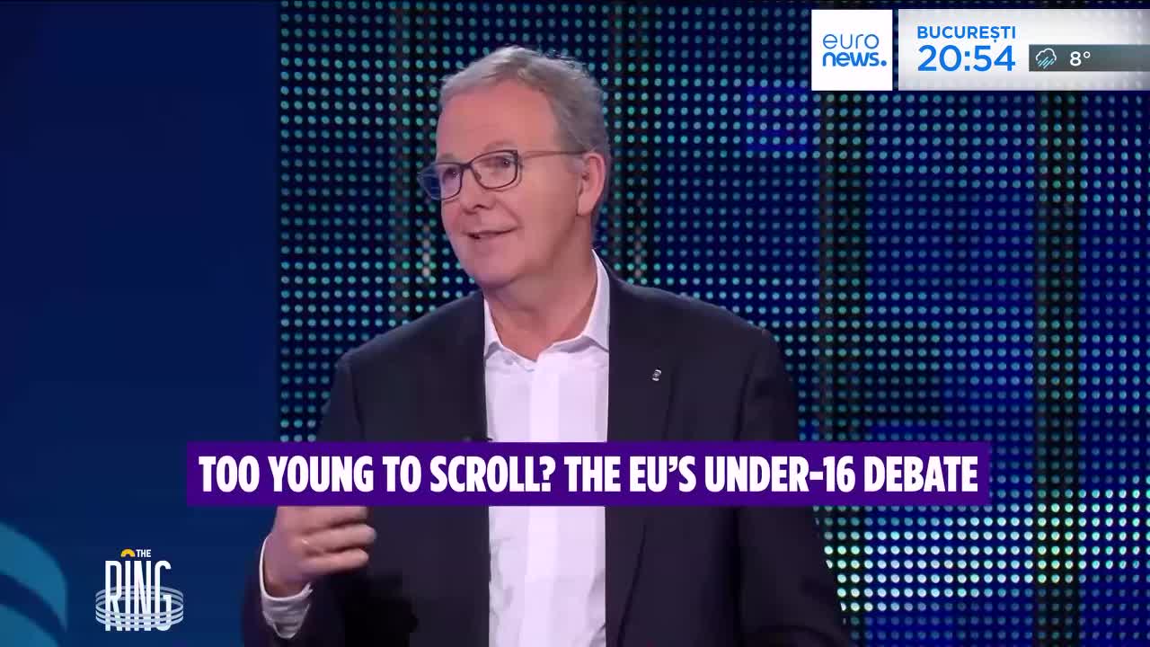 A man in a suit speaks, gesturing with his hands. A graphic overlay reads "TOO YOUNG TO SCROLL? THE EU'S UNDER-16 DEBATE." A man in a suit speaks, gesturing with his hands. A graphic overlay reads "TOO YOUNG TO SCROLL? THE EU'S UNDER-16 DEBATE."