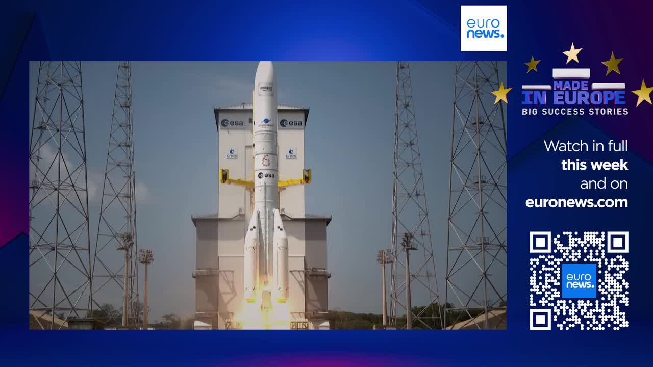A massive rocket, emblazoned with "ESA," ignites its engines and begins its ascent from the launchpad. The bright flames and smoke billow out from beneath the towering structure.