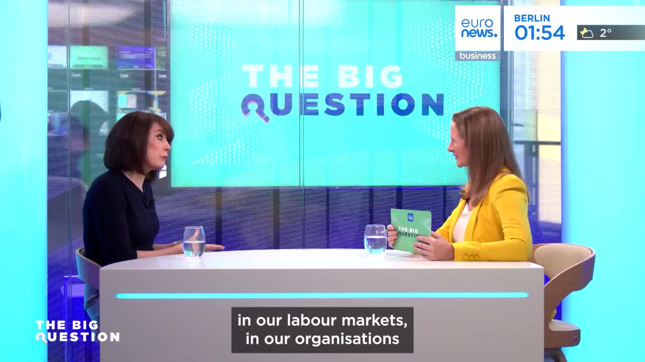 Two women sit at a desk in a studio, discussing business matters. The backdrop displays "THE BIG QUESTION" in large letters, with the Euronews logo visible in the corner.