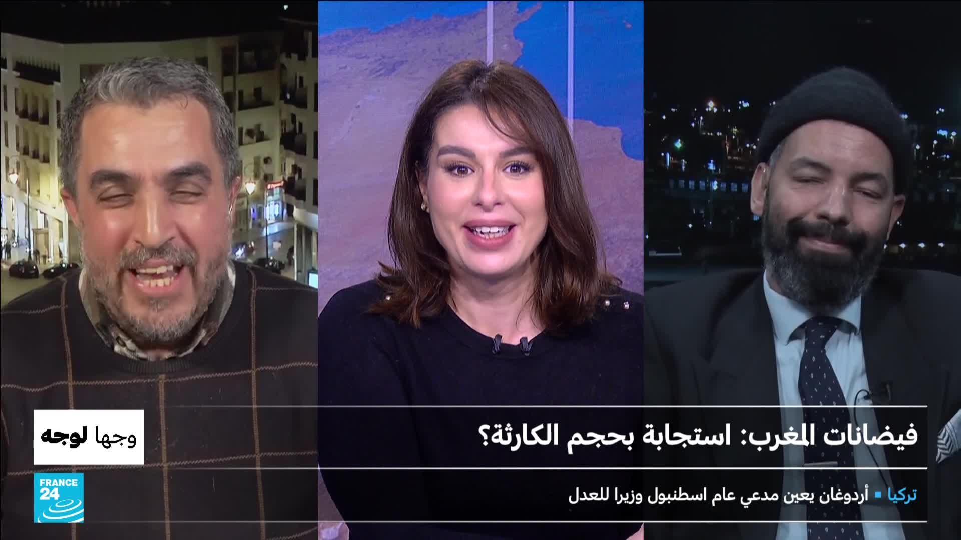 A man with a beard and a beanie leans back, eyes closed, while a woman with dark hair smiles at the camera. To the left, another man gestures animatedly, his mouth open mid-sentence.