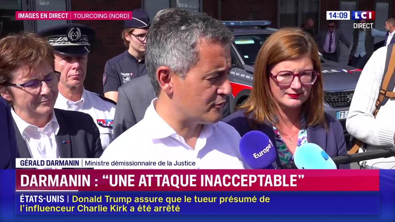 Gérald Darmanin, the outgoing Minister of Justice, is speaking into microphones held by reporters, flanked by other officials. The live broadcast on LCI displays a headline about his remarks on an "unacceptable attack."

