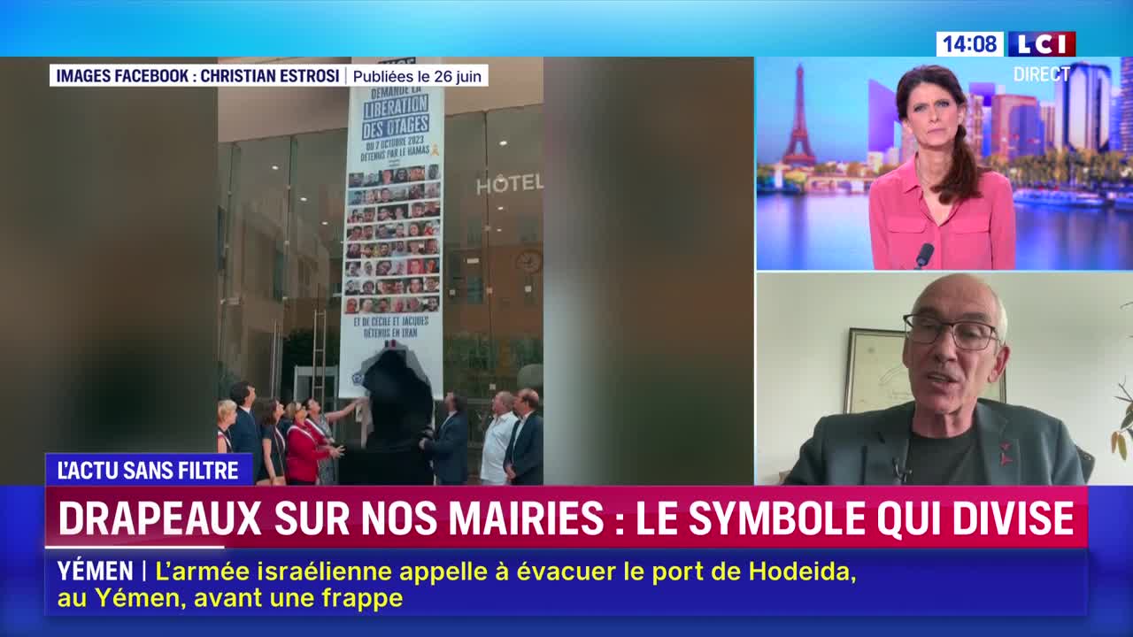 A group of people stand in front of a building, unveiling a banner with photos and text about hostages. Meanwhile, on LCI, a news anchor and a commentator are discussing the topic of flags in French town halls.
