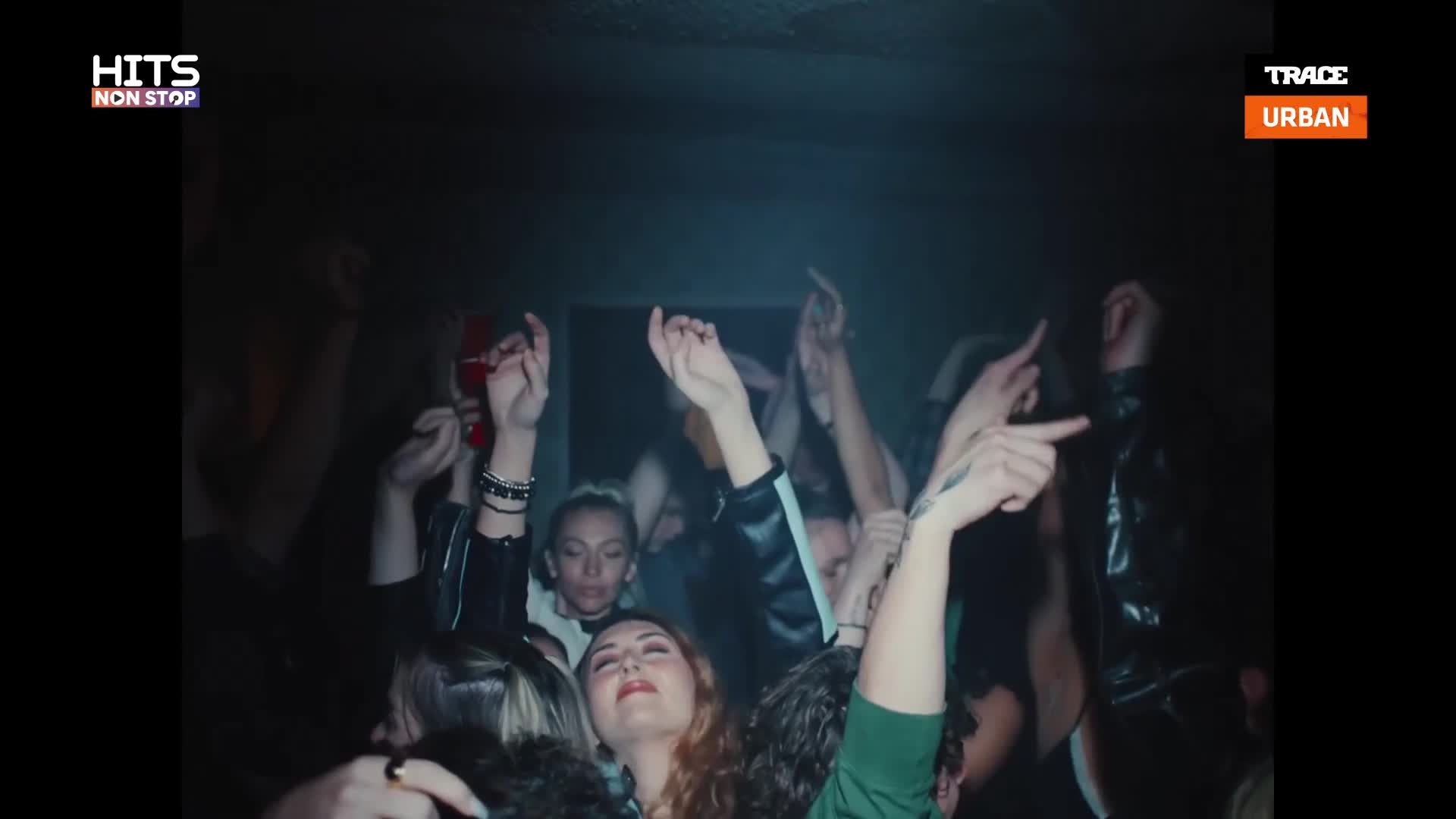 Hands are raised in unison, reaching towards the dark ceiling of this club in France. The energy is palpable as the crowd bobs to the rhythm, a shared moment amplified by the Trace Urban beat.