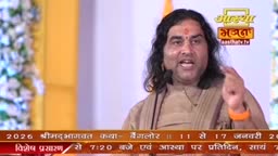 A man with long dark hair and a red mark on his forehead is speaking, gesturing with his right hand. The Aastha Bhajan logo is visible above him, and text at the bottom mentions a broadcast from Bangalore.
