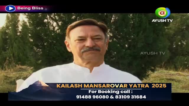 A man in a white shirt is speaking on Ayush TV, with a backdrop of greenery. A banner at the bottom promotes the Kailash Mansarovar Yatra 2025, including a booking phone number.

