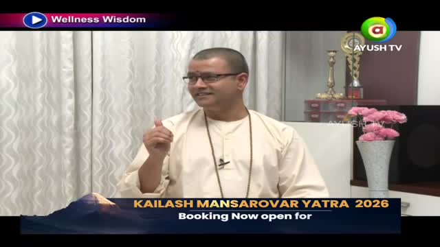 A man in a light-colored kurta gestures with his thumb up. A banner below him announces "Kailash Mansarovar Yatra 2026."