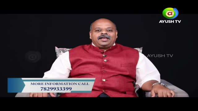 A man in a maroon vest over a white shirt speaks directly to the camera. A graphic at the bottom displays "MORE INFORMATION CALL 782993399."