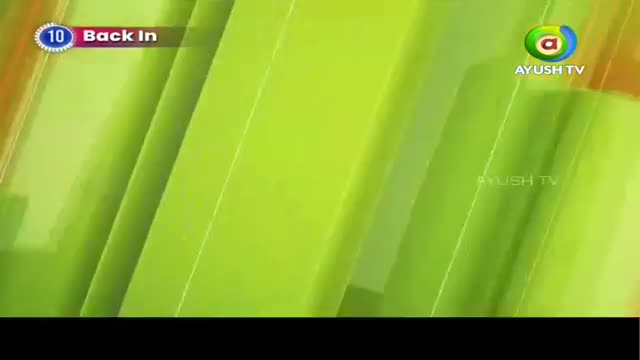 The screen displays a graphic with diagonal lines of lime green and orange. A small blue circle with the number 10 inside it sits next to the words "Back In." The screen displays a graphic with diagonal lines of lime green and orange. A small blue circle with the number 10 inside it sits next to the words "Back In."