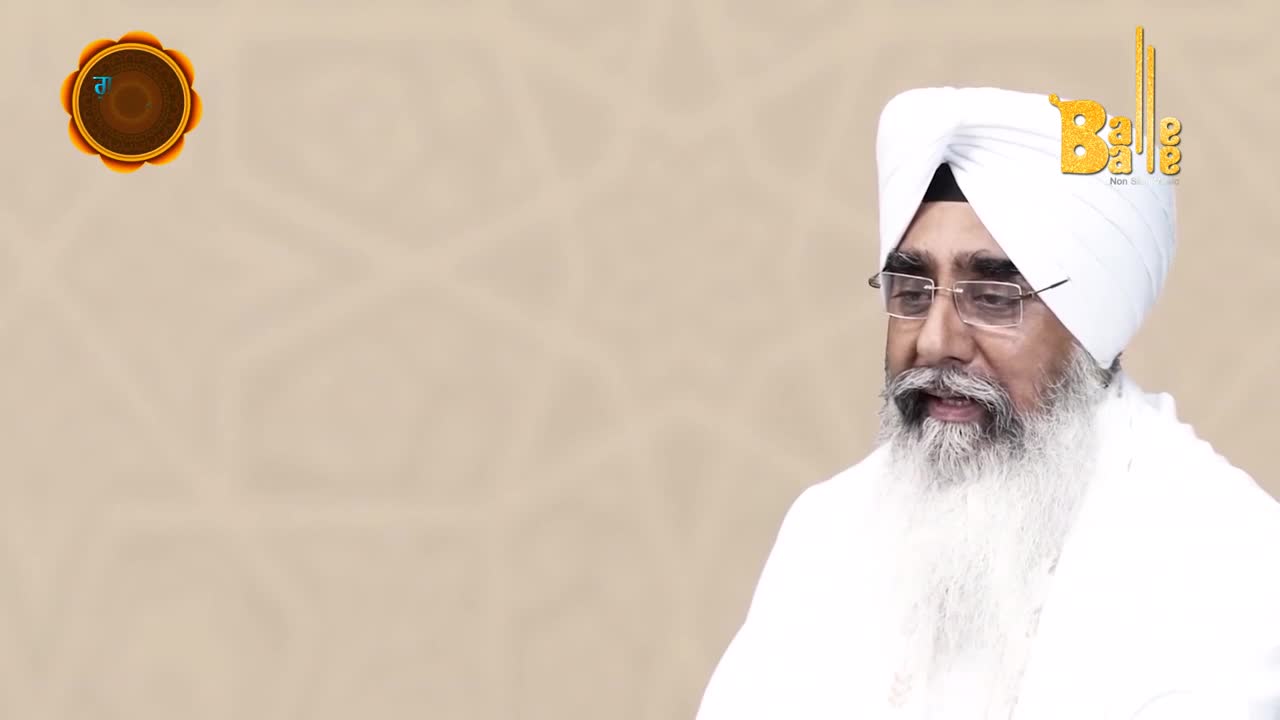 A man in a white turban and beard speaks, the "Balle Balle" logo perched above his head. A golden emblem sits in the corner, and the background is a soft, textured beige.
