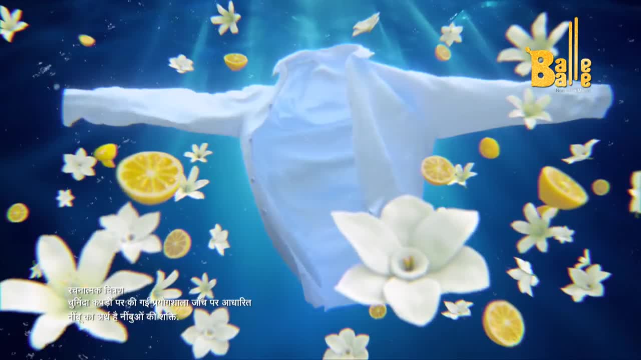 A white shirt floats in a sea of blue, its sleeves outstretched as if embracing the air.  Scattered around it are lemon slices and jasmine blossoms, like a fragrant, summery dance.
