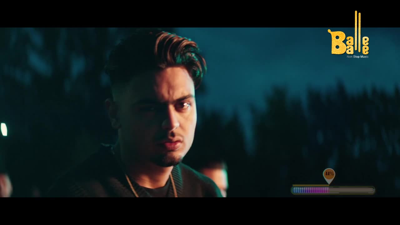 The man stares directly at the camera, his expression serious under the moody lighting. A Balle Balle logo sits in the corner, and a progress bar indicates the song is well underway.
