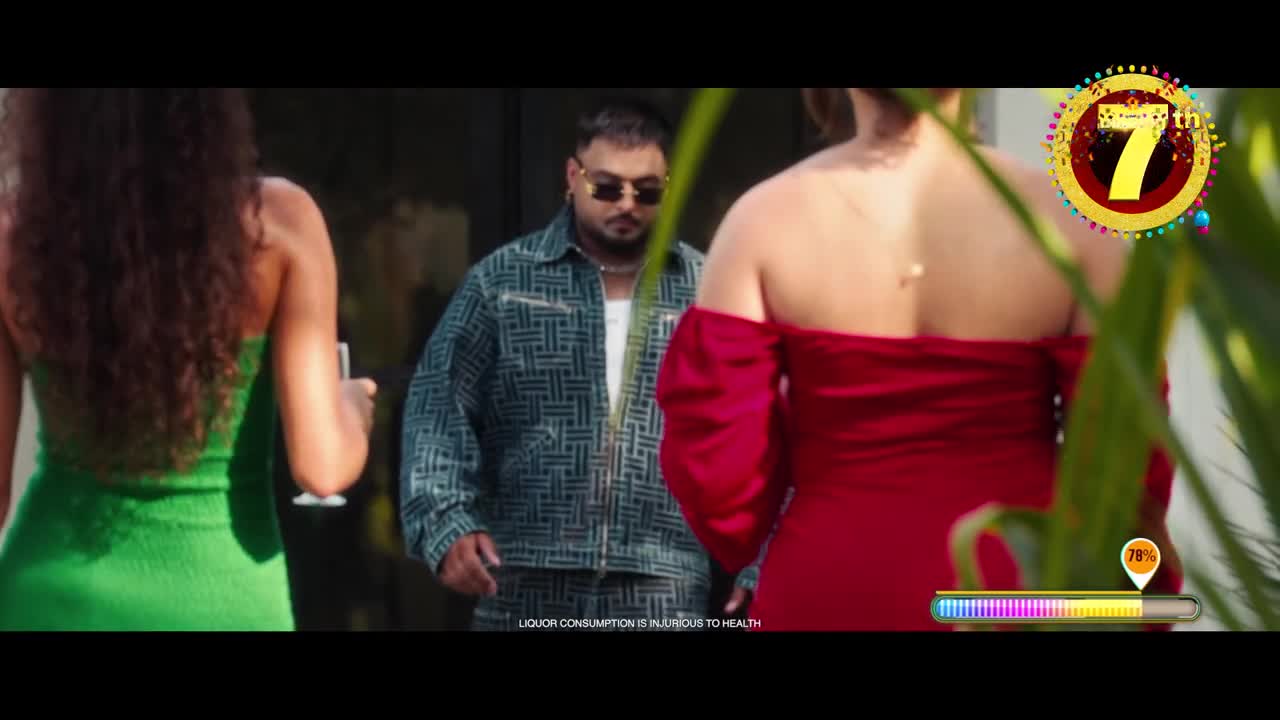 A man in a patterned jacket and sunglasses walks forward, flanked by two women in bright dresses. The scene feels like a music video, with the "7th" graphic and a progress bar in the corner.
