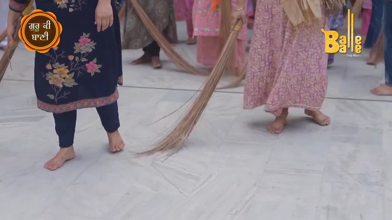 Bare feet shuffle across the marble floor, each holding a broom made of long, stiff bristles. They're sweeping in unison, the brooms creating a rhythmic motion.
Bare feet shuffle across the marble floor, each holding a broom made of long, stiff bristles. They're sweeping in unison, the brooms creating a rhythmic motion.