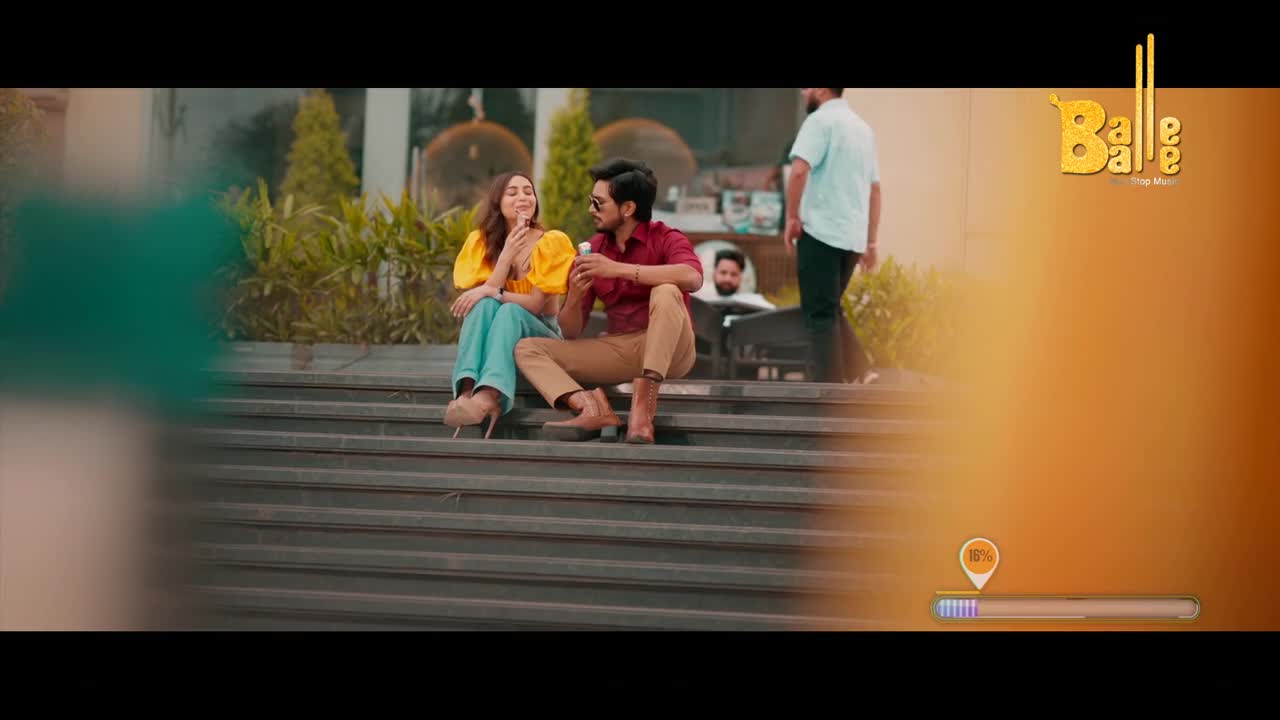 A couple sits on the steps, enjoying what looks like ice cream. A man in a white shirt walks past in the background, while the Balle Balle logo sits in the corner.
A couple sits on the steps, enjoying what looks like ice cream. A man in a white shirt walks past in the background, while the Balle Balle logo sits in the corner.