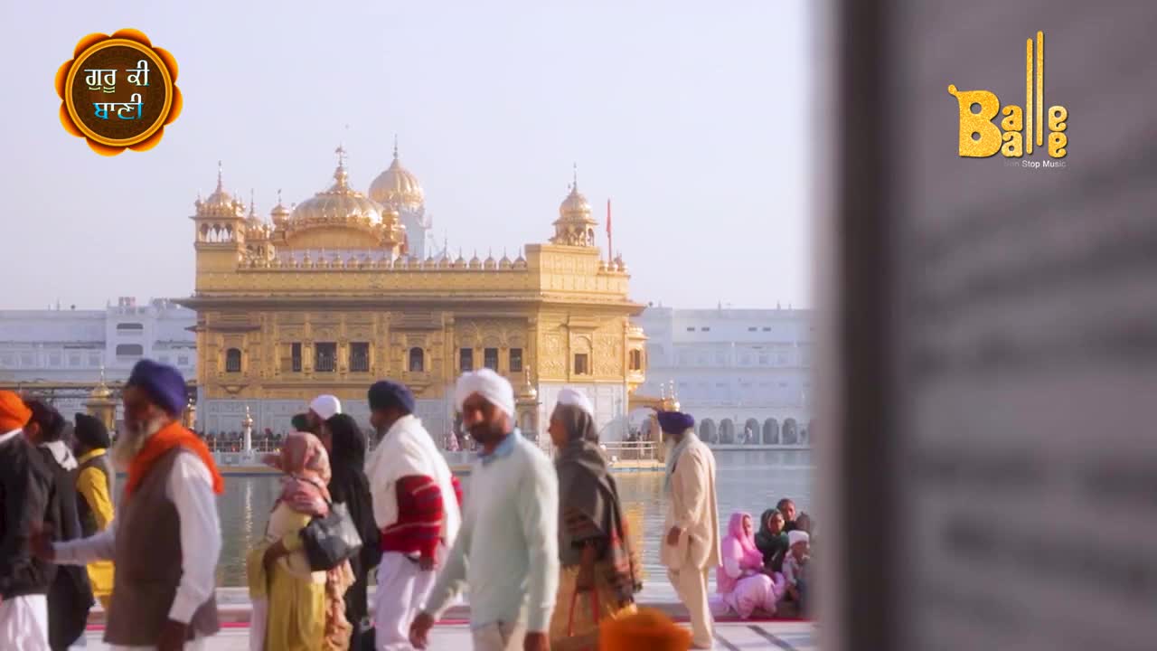 Pilgrims in turbans and shawls stroll towards the golden temple, while "Balle Balle" music plays. The sun glints off the domes as people gather, ready to celebrate.
