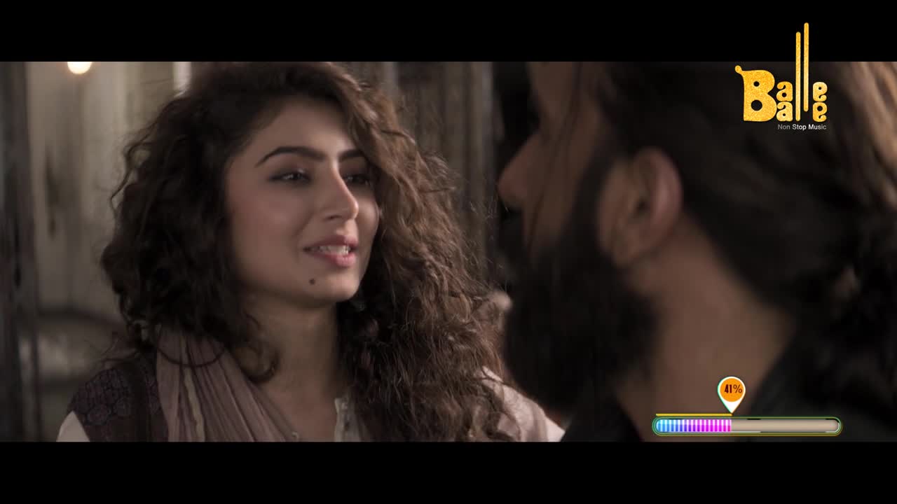 A woman with curly brown hair gazes at a man, her expression soft. The Balle Balle logo sits in the corner, and a progress bar fills up on the screen.
