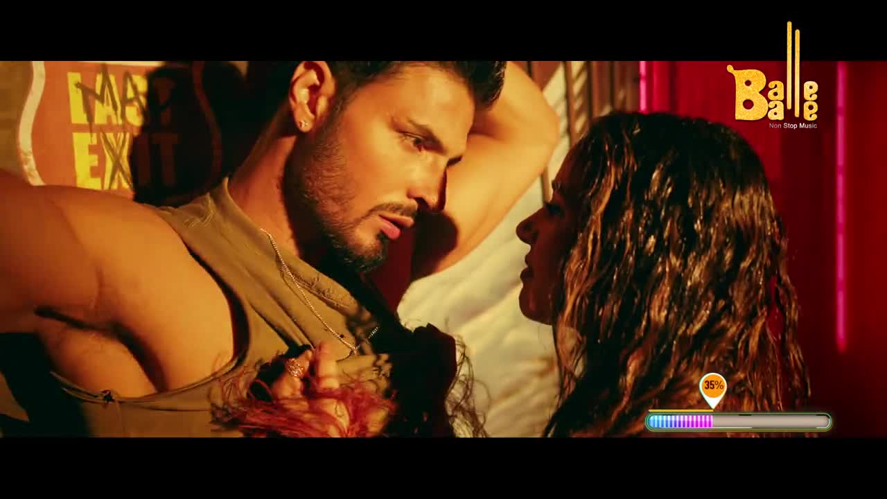 A man with a beard leans in close to a woman, their faces almost touching. The Balle Balle logo glows in the corner.