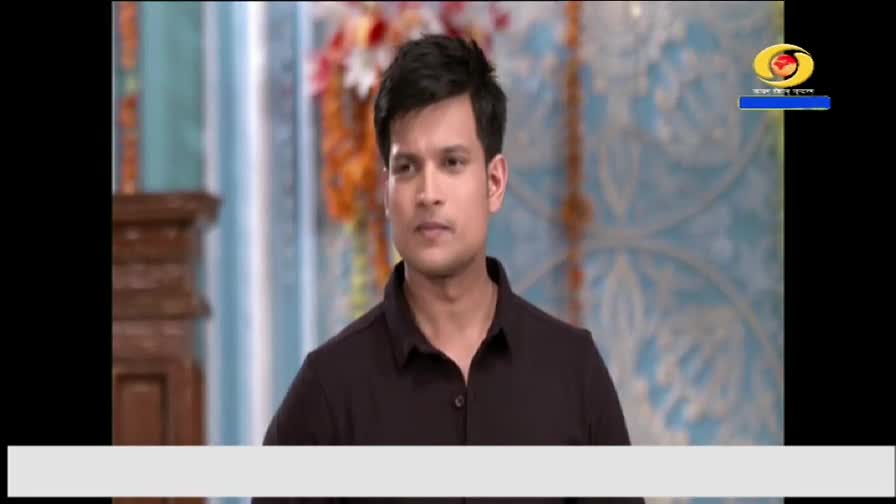 A man in a dark shirt looks directly at the camera, his expression neutral. The DD Arun Prabha logo is visible in the corner, likely indicating a broadcast from India.
