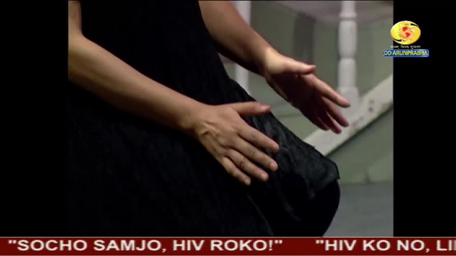 A person's hands are open, palms facing the camera, gesturing over a dark dress. The DD Arun Prabha logo is visible in the corner, and the caption reads, "Think, understand, stop HIV!"

