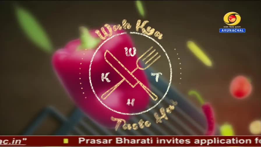 A large red bell pepper fills the foreground, with a circular graphic of crossed cutlery and lettering that reads "Wah Kya Taste Hai." The DD Arun Prabha logo appears in the upper right corner.