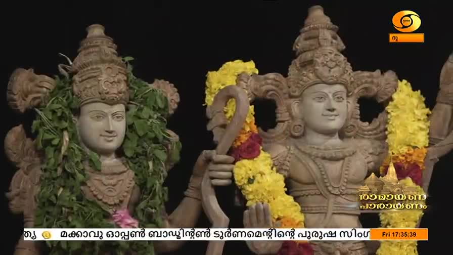 Two stone statues of deities stand side-by-side, adorned with garlands and greenery. The DD Malayalam logo is visible in the corner, and the time reads 17:35:39.
