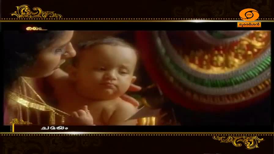 A woman cradles a baby, her face close to its cheek. The baby's gaze is fixed on something just out of frame.