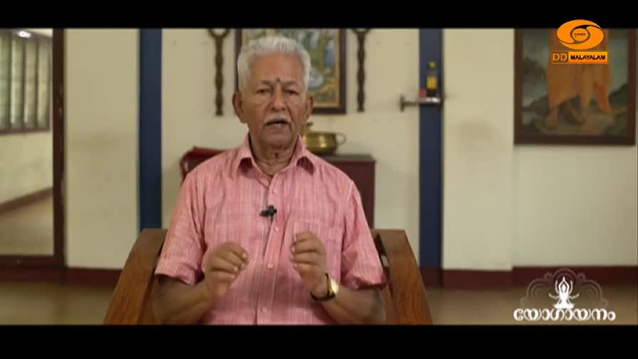 An older gentleman in a pink shirt speaks, gesturing with his hands. The DD Malayalam logo is visible in the corner.