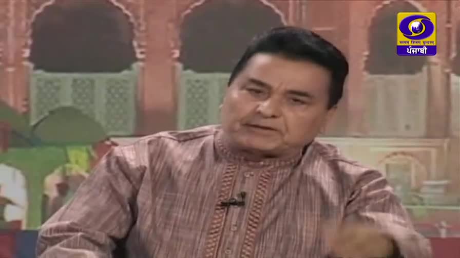 A man in a patterned kurta speaks animatedly, his right hand gesturing. The DD Punjabi logo is visible in the corner of the screen.