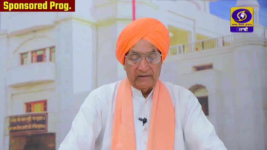 An elderly man in an orange turban and shawl speaks into a microphone. The DD Punjabi logo is visible in the corner.