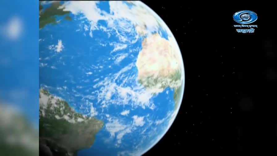 The Earth turns, continents of green and tan emerging from swirling white clouds. A logo for DD Sahyadri, a television channel from India, is visible in the dark expanse.