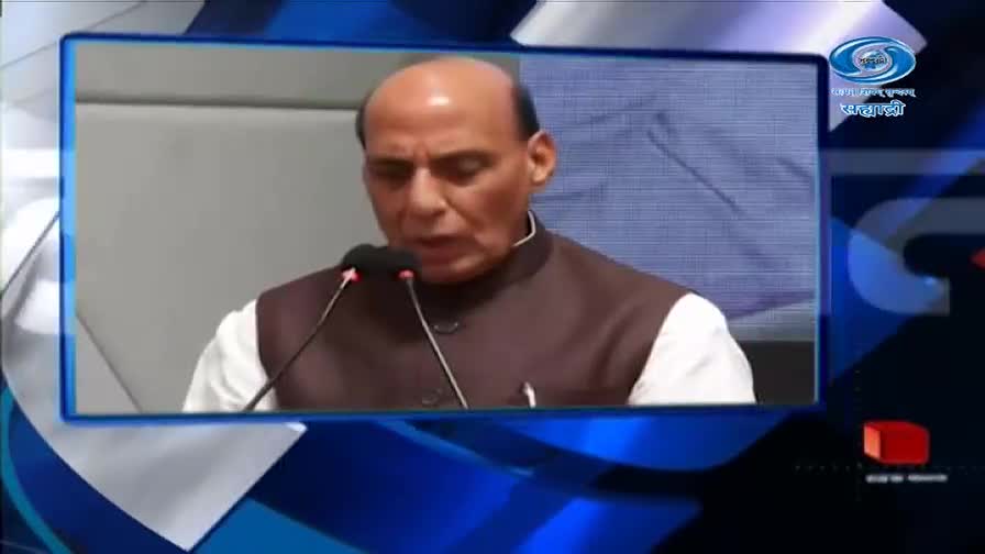 A man in a brown vest over a white shirt speaks into two microphones. The DD Sahyadri logo appears in the upper right corner. A man in a brown vest over a white shirt speaks into two microphones. The DD Sahyadri logo appears in the upper right corner.