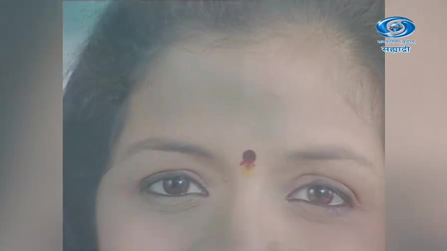 A woman's eyes look directly ahead, a small red and yellow bindi centered on her forehead. The DD Sahyadri logo appears in the upper right corner. A woman's eyes look directly ahead, a small red and yellow bindi centered on her forehead. The DD Sahyadri logo appears in the upper right corner.