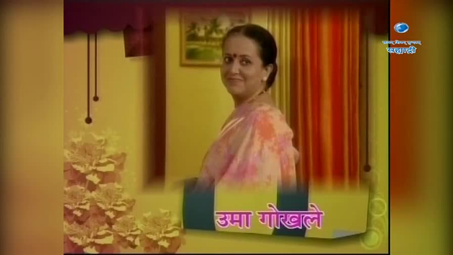 A woman in a pink sari smiles, her hair pulled back neatly. The DD Sahyadri logo appears in the upper right corner, with Marathi text below it.