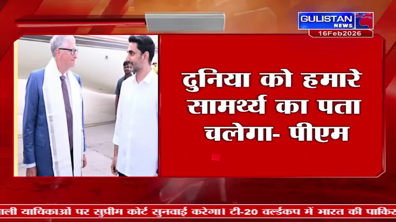 Two men stand on an airfield, one in a blue suit and white scarf, the other in a white shirt.  A Gulistan News broadcast displays Hindi text overlaying the scene.