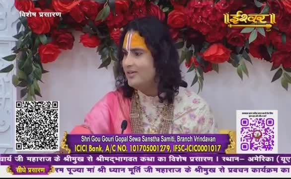 A man with a painted forehead and long hair is speaking, framed by red roses and greenery. The broadcast from India, on Ishwar Bhakti TV, is promoting a religious event.
