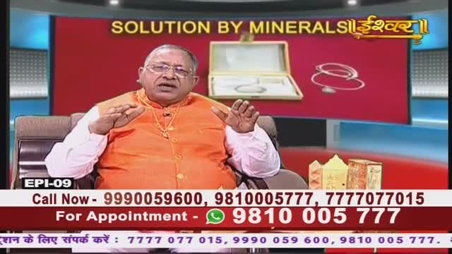 On the Ishwar Bhakti TV program, a man in an orange vest gestures with his hands, speaking directly to the camera. Behind him, a red backdrop displays the show's title and a graphic of jewelry.
On the Ishwar Bhakti TV program, a man in an orange vest gestures with his hands, speaking directly to the camera. Behind him, a red backdrop displays the show's title and a graphic of jewelry.