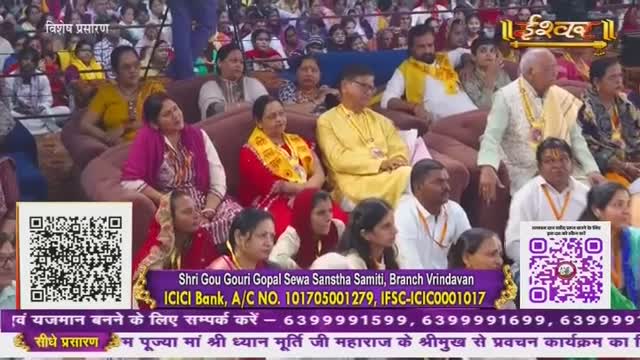 People are seated on a tiered platform, many wearing yellow or red shawls. The Ishwar Bhakti TV logo is visible, and the event is being broadcast live from India.
