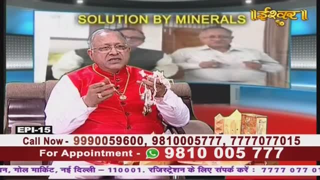 On Ishwar Bhakti TV, a man in a red jacket gestures with a string of beads, speaking while seated in front of a screen. The broadcast includes phone numbers for appointments and a location in New Delhi.
On Ishwar Bhakti TV, a man in a red jacket gestures with a string of beads, speaking while seated in front of a screen. The broadcast includes phone numbers for appointments and a location in New Delhi.