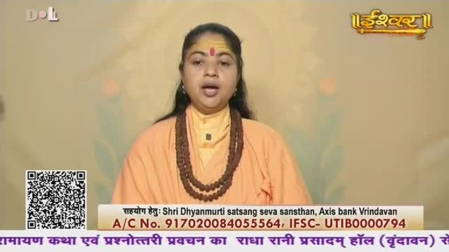 A woman in an orange robe speaks directly to the camera, her expression earnest. A string of brown beads hangs around her neck, and a yellow mark adorns her forehead.