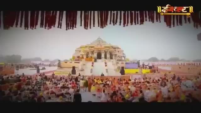 A crowd gathers before a grand temple in India, the Ishwar Bhakti TV logo visible overhead. People in colorful attire fill the plaza, facing the ornate structure.