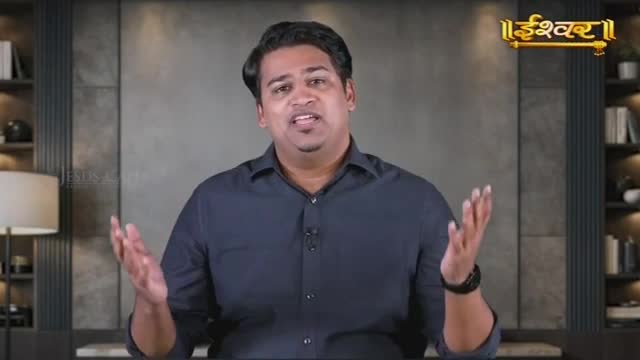 A man in a dark shirt speaks with his hands open, gesturing towards the camera. The Ishwar logo appears in the upper right corner.