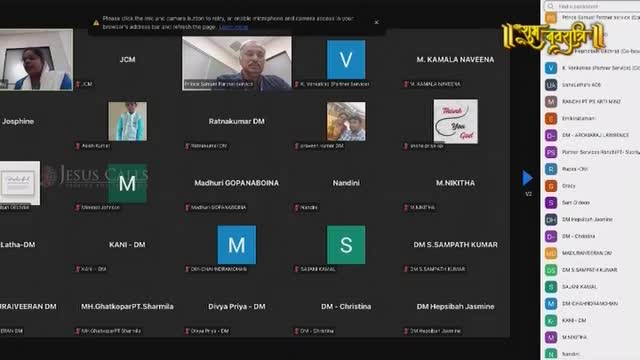 A man with a salt-and-pepper mustache smiles from his screen, while a woman in a blue and white top speaks. The Ishwar Bhakti TV logo appears in the corner, a reminder of the broadcast.