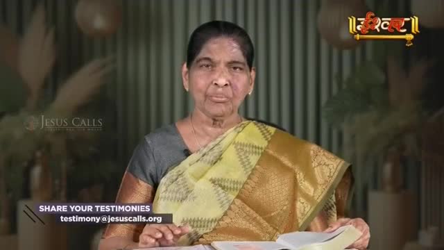A woman in a yellow and gold sari is speaking, her hands resting on an open book. The Ishwar Bhakti TV logo is visible in the upper right corner.