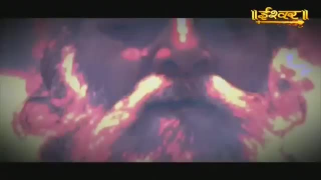 A face with a long, flowing beard emerges from a swirling, fiery background. The "Ishwar" logo from Ishwar Bhakti TV appears at the top right.