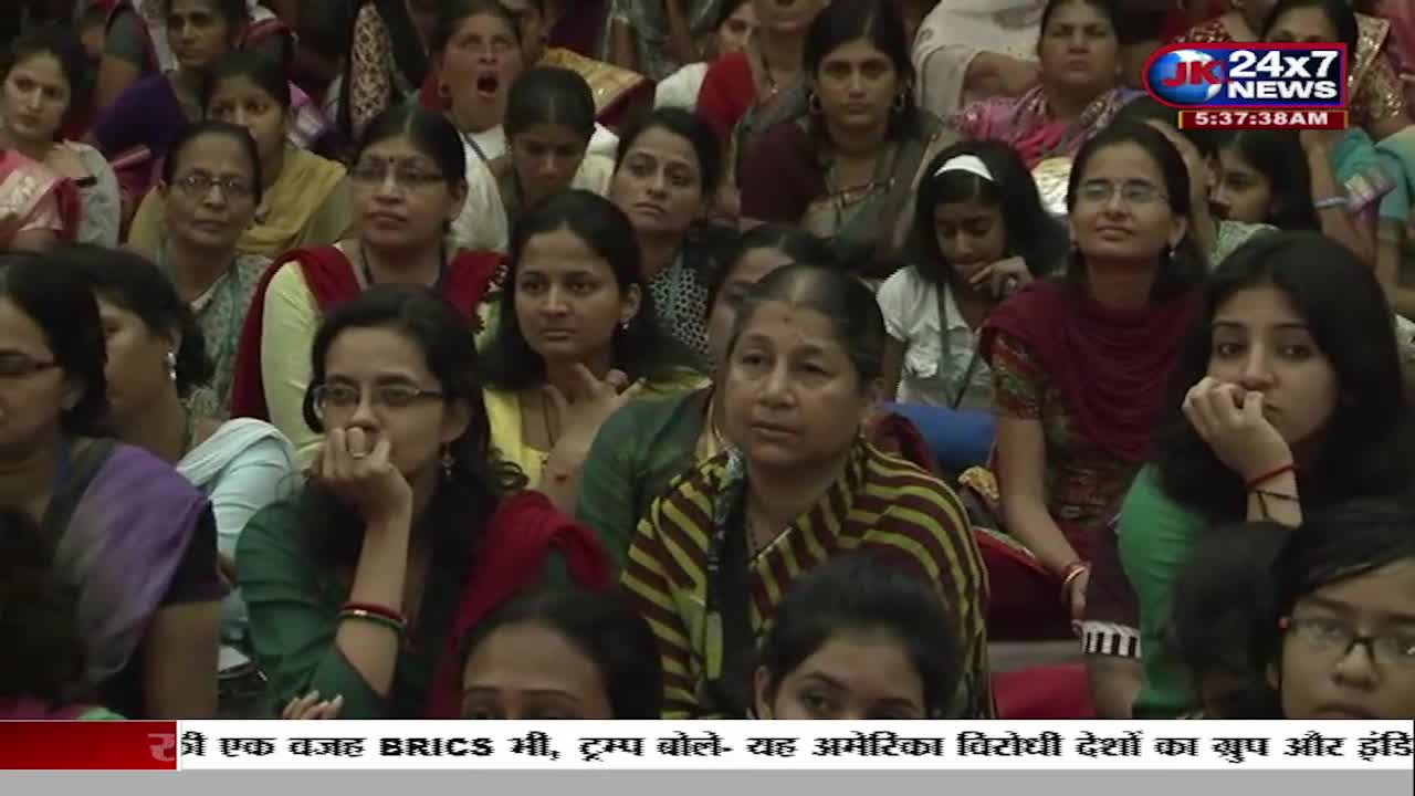 A large group of women are seated, many with their hands near their faces, appearing to listen intently. The JK 24x7 News logo and a news ticker in Hindi are visible in the corner of the screen.
