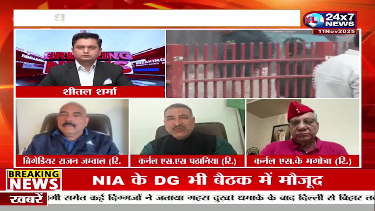 A news anchor in a suit is on the screen, while three retired military officers appear in smaller windows below. The JK 24x7 News broadcast shows a scene of a red gate and a hazy background, likely related to the breaking news.
A news anchor in a suit is on the screen, while three retired military officers appear in smaller windows below. The JK 24x7 News broadcast shows a scene of a red gate and a hazy background, likely related to the breaking news.