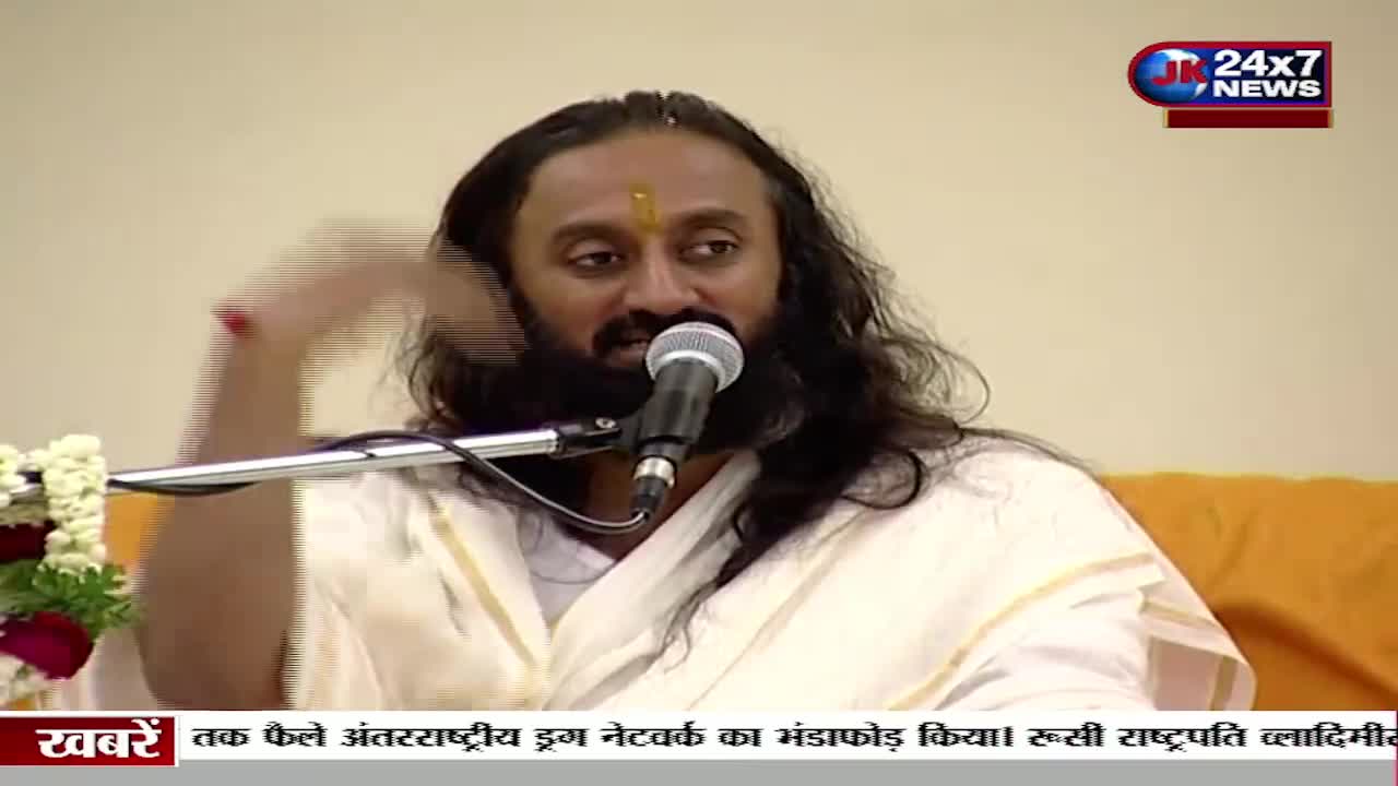 A man with long, dark hair and a beard speaks into a microphone, gesturing with his right hand. The JK 24x7 News logo is visible in the corner, and the bottom of the screen displays headlines in Hindi.
A man with long, dark hair and a beard speaks into a microphone, gesturing with his right hand. The JK 24x7 News logo is visible in the corner, and the bottom of the screen displays headlines in Hindi.